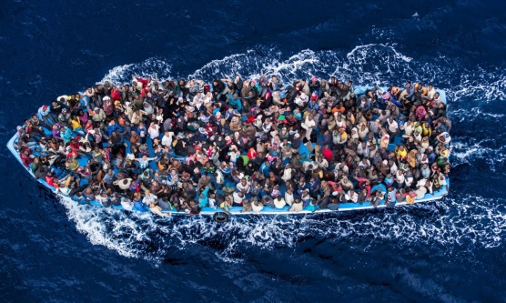 A boatload of refugees rescued 20 miles north of Libya by the Italian Navy during Operation Mare Nostrum in 2014. Massimo Sestini's stunning photograph took second prize in this year's World Press Photo competition.